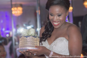 Bride presenting cake to mother-in-law